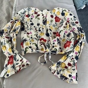 H&M blouse with bell sleeve and tie across the mid drift. Wild flower print